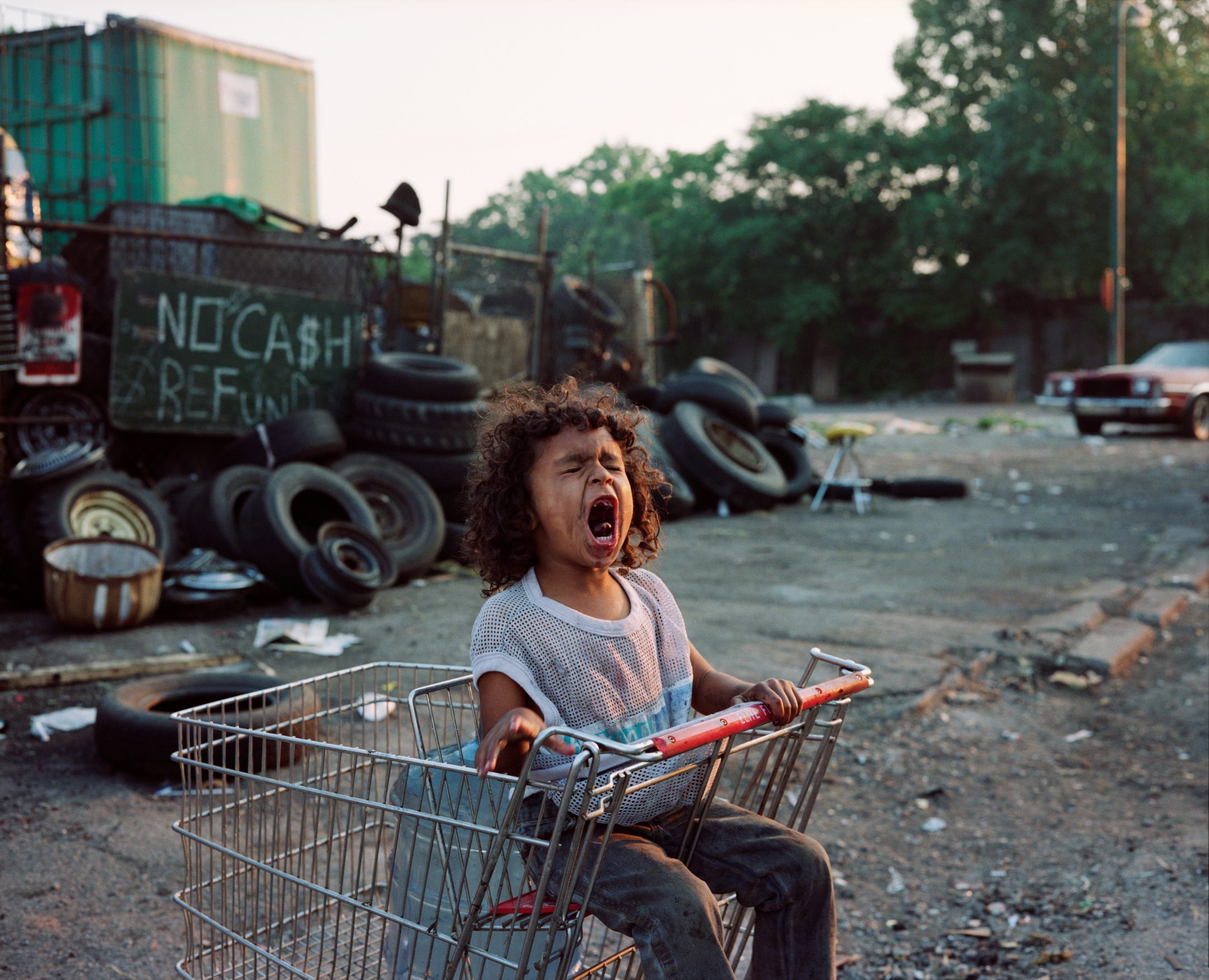 Paul D'Amato - Girl in Shopping Cart, 1989